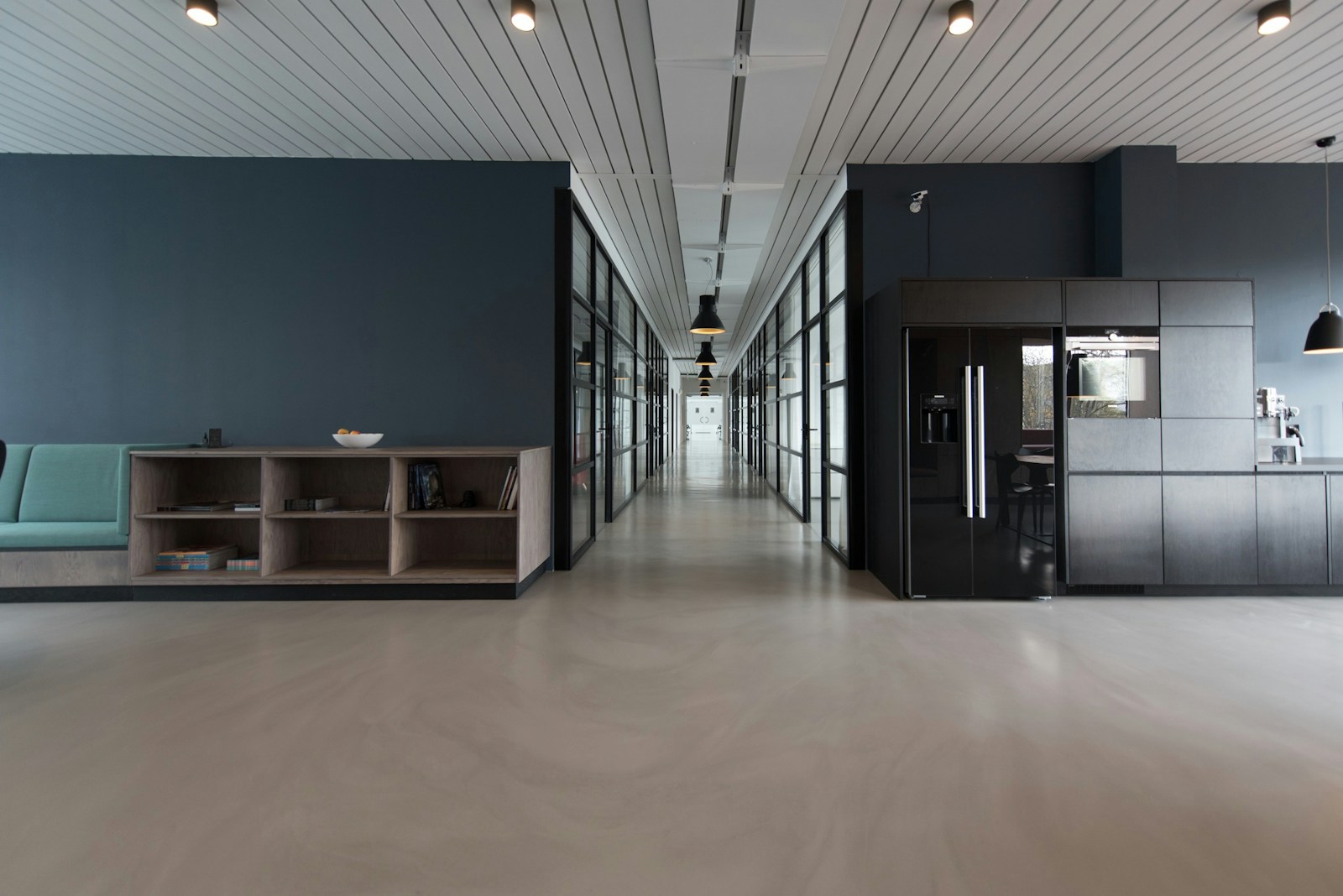 Illustrative corporate office interior showing modular desking and timber finishes